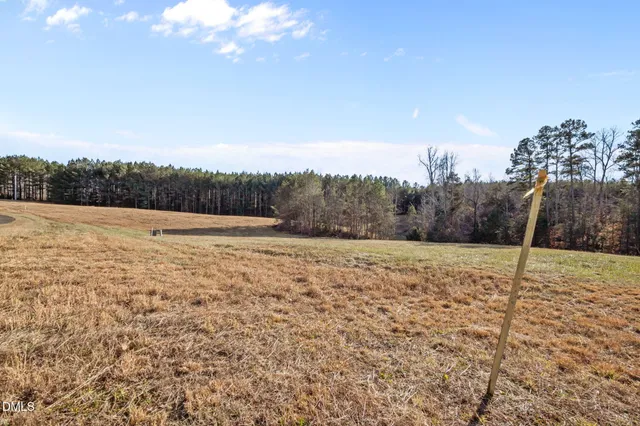 a view of big yard with an outdoor space