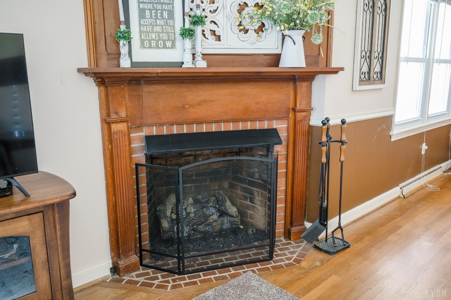 41 Piedmont Road Rustburg, VA 24588 - Photo 11 of 51 a living room with a fireplace and a window