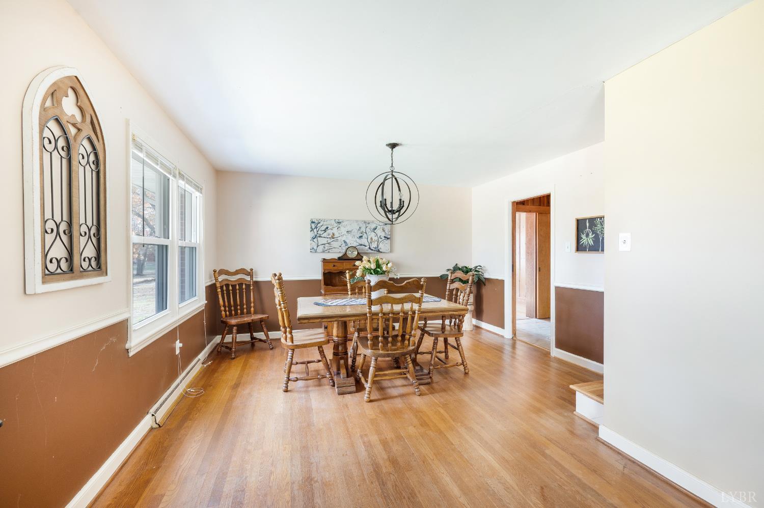 41 Piedmont Road Rustburg, VA 24588 - Photo 12 of 51 a view of a dining room with furniture window and wooden floor
