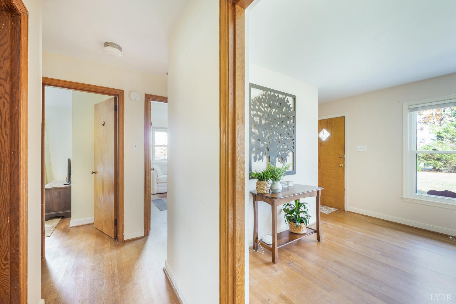 41 Piedmont Road Rustburg, VA 24588 - Photo 27 of 51 a view of a hallway with wooden floor windows and a livingroom