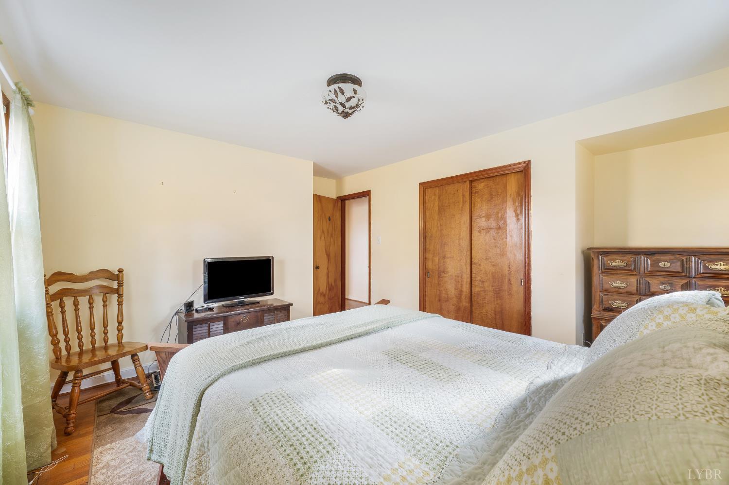 41 Piedmont Road Rustburg, VA 24588 - Photo 30 of 51 a bedroom with a bed and a flat screen tv