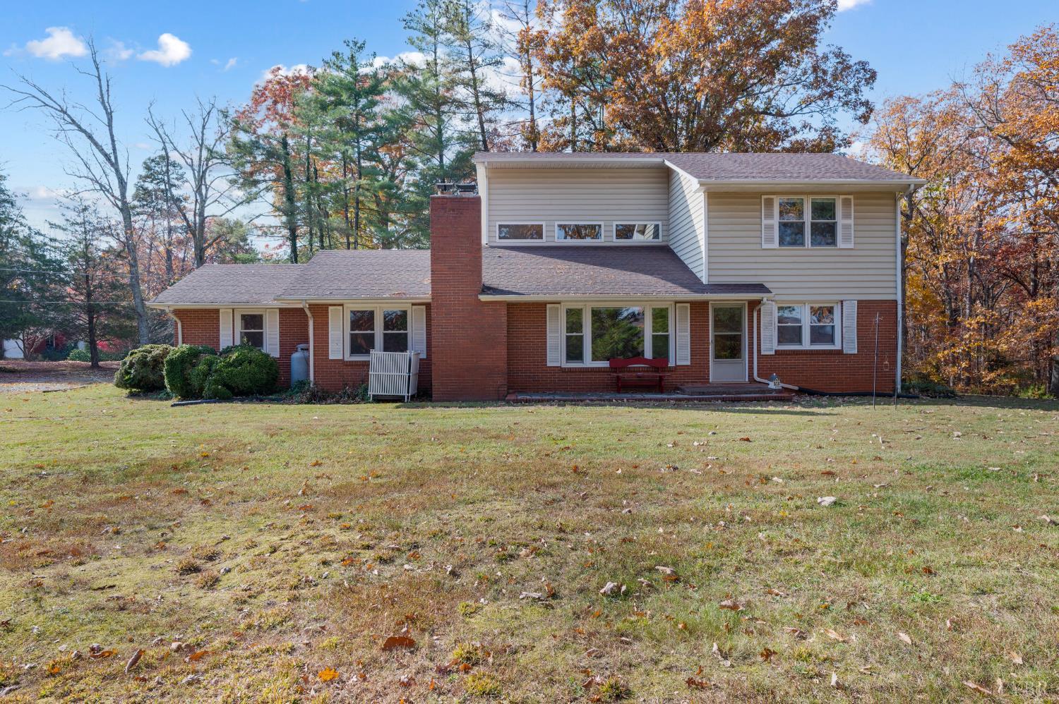 41 Piedmont Road Rustburg, VA 24588 - Photo 3 of 51 a front view of a house with garden