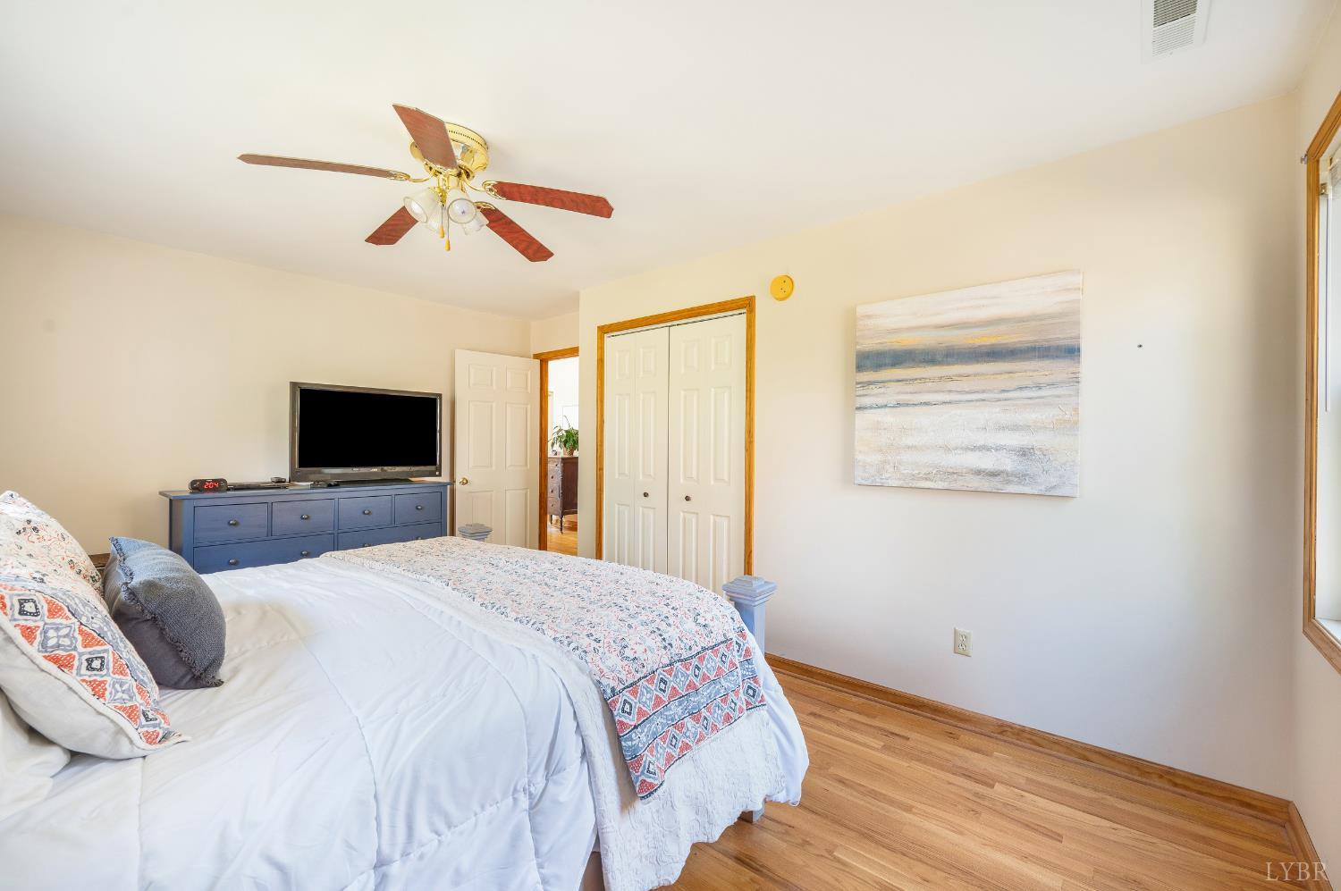 41 Piedmont Road Rustburg, VA 24588 - Photo 38 of 51 a bedroom with a large bed and a flat screen tv