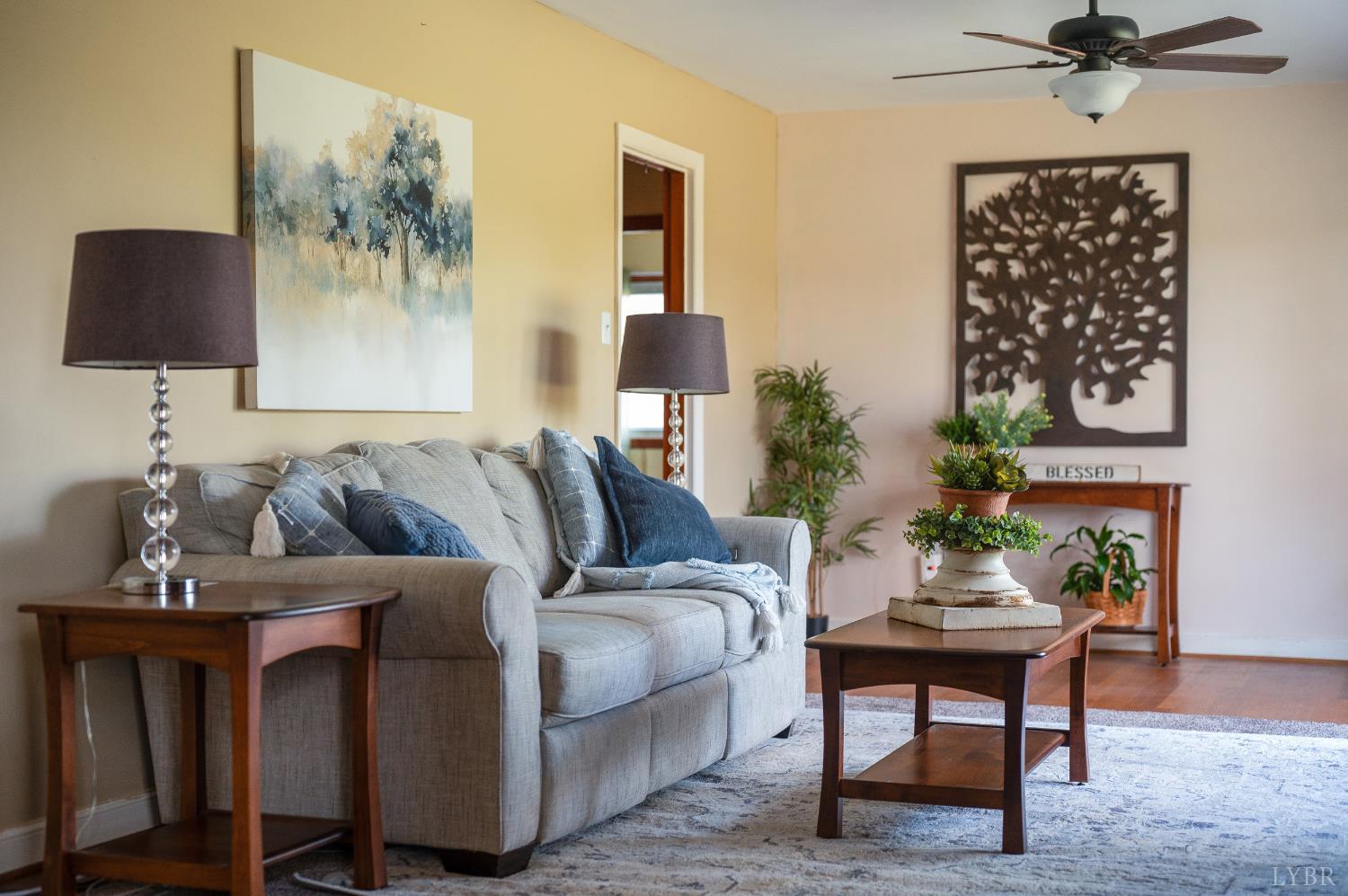 41 Piedmont Road Rustburg, VA 24588 - Photo 9 of 51 a living room with furniture and a lamp