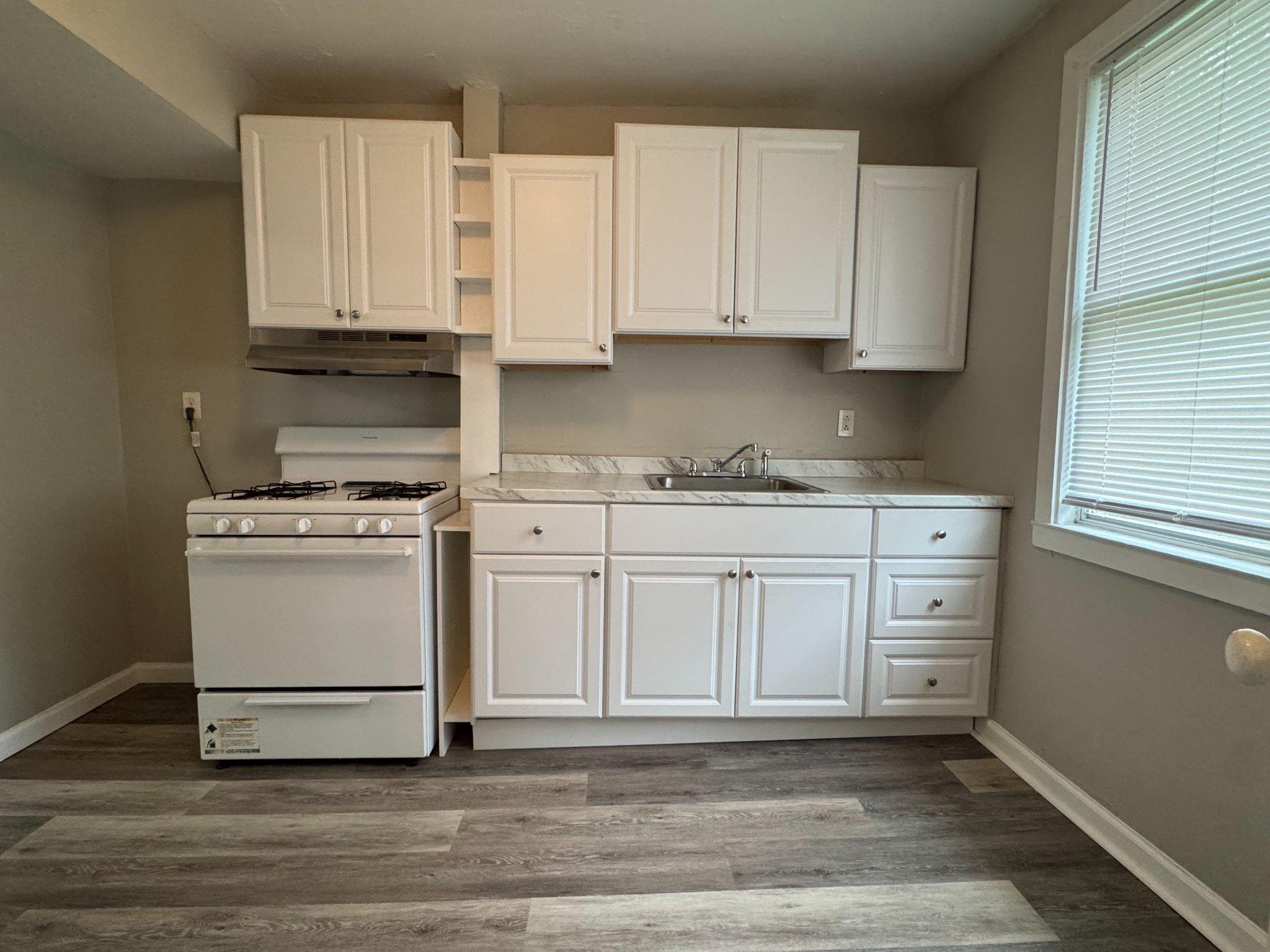 410 Austin Court Wallingford, PA 19086 - Photo 4 of 16 Kitchen with New cabinets and flooring.