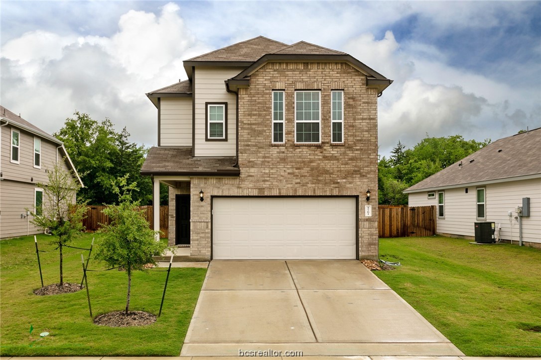 5761 Cerrillos Drive Bryan, TX 77807 - Photo 1 of 1 a front view of a house with a yard