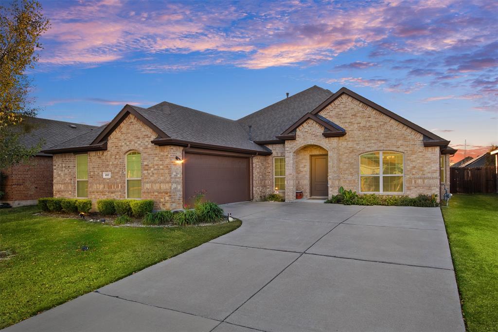 217 Watson Street Red Oak, TX 75154 - Photo 1 of 40 a front view of a house with a yard