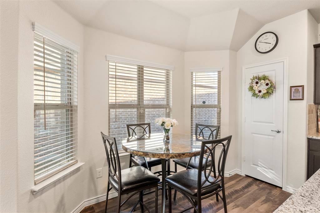 217 Watson Street Red Oak, TX 75154 - Photo 13 of 40 a view of a dining room with furniture and a large window