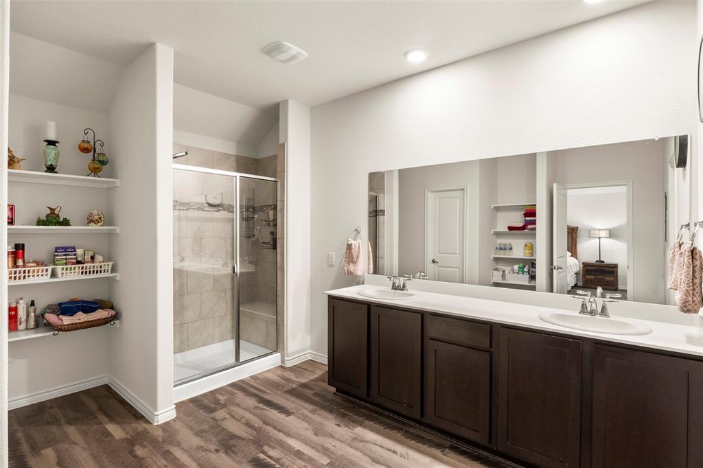 217 Watson Street Red Oak, TX 75154 - Photo 23 of 40 a bathroom with a double vanity sink and mirror