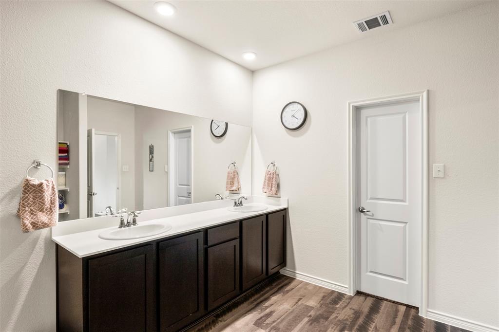 217 Watson Street Red Oak, TX 75154 - Photo 24 of 40 a bathroom with a double vanity sink and a mirror
