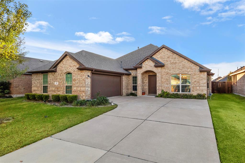 217 Watson Street Red Oak, TX 75154 - Photo 3 of 40 a front view of house with yard and green space
