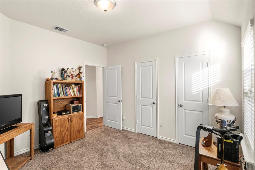 217 Watson Street Red Oak, TX 75154 - Photo 29 of 40 a view of a workspace with furniture and a window