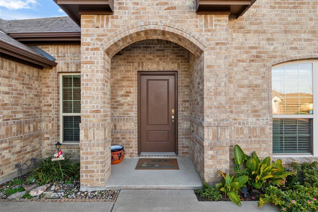 217 Watson Street Red Oak, TX 75154 - Photo 4 of 40 a stone building with a door