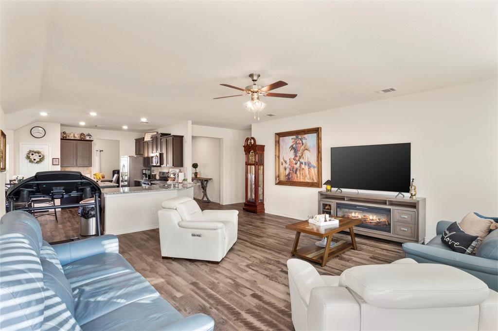 217 Watson Street Red Oak, TX 75154 - Photo 10 of 40 a living room with furniture and a flat screen tv