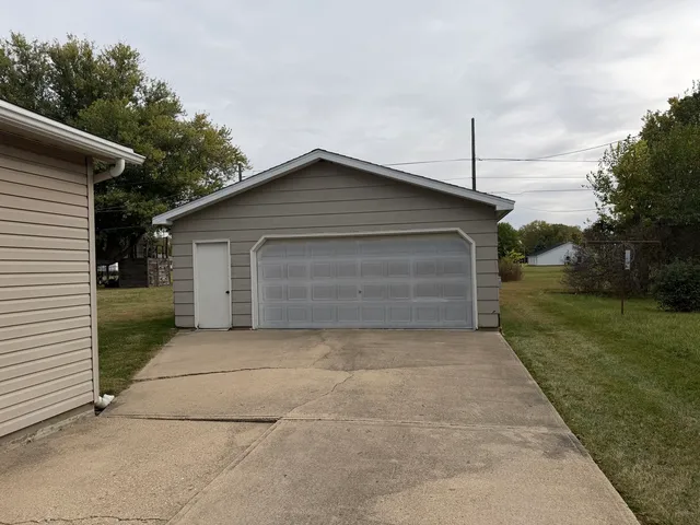 a front view of a house with garage