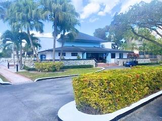 7705 Southwest 86th Street, Unit B213 Miami, FL 33143 - Photo 13 of 14 a view of a swimming pool with a patio