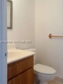 a bathroom with a toilet and a sink