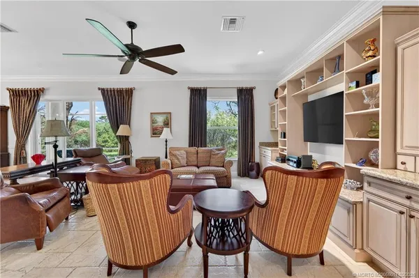 a view of a porch with wooden floor and fence