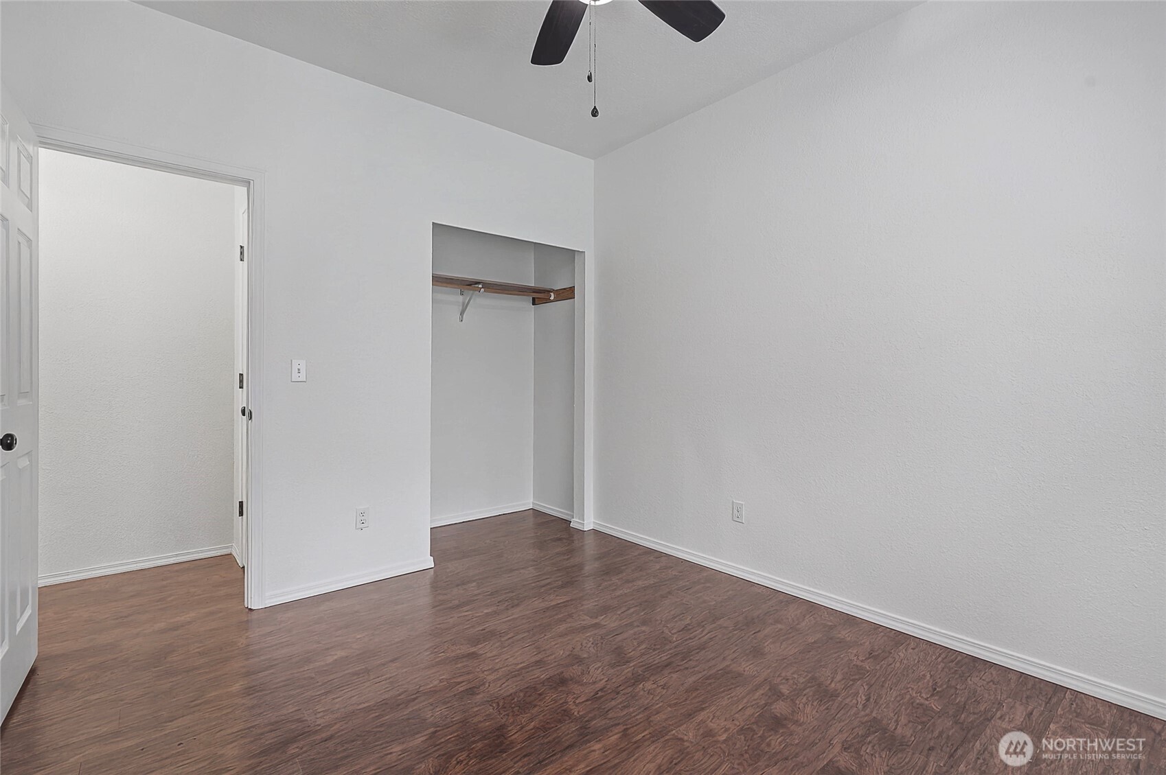 7239 Long Lake Road Southeast Port Orchard, WA 98367 - Photo 13 of 22 a view of an empty room with wooden floor