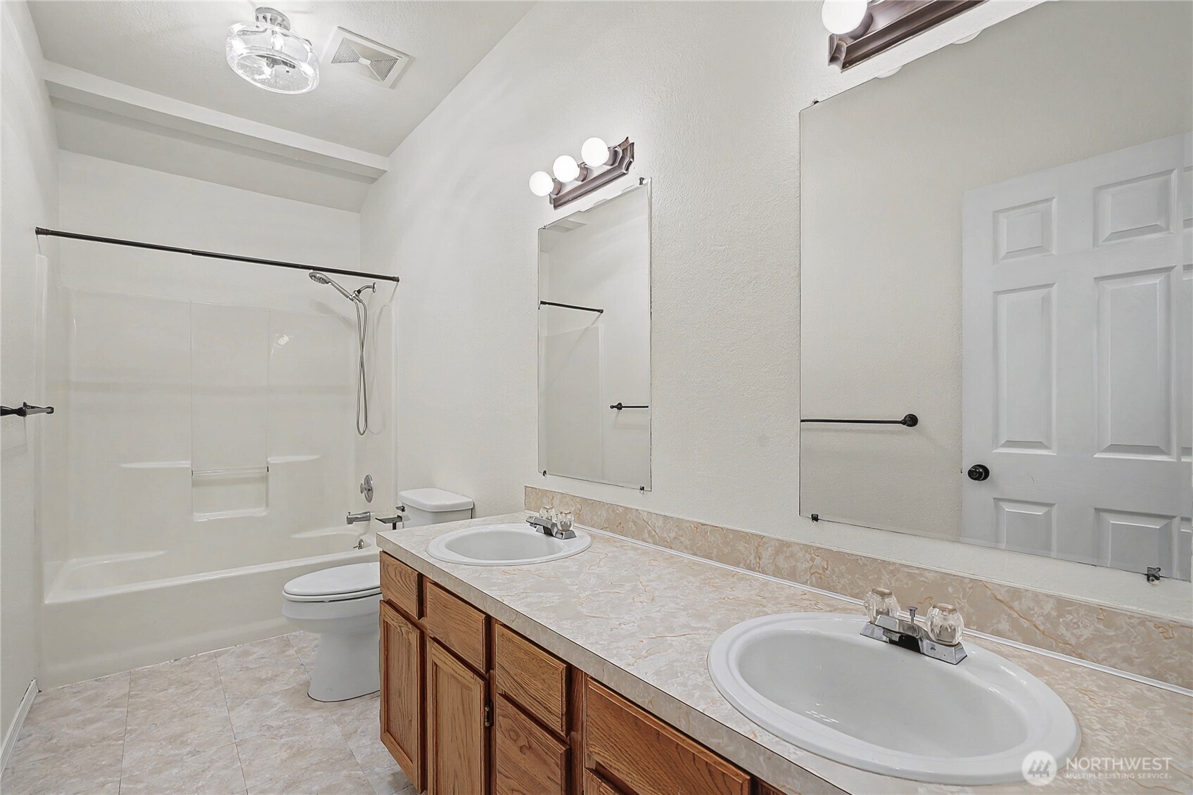 7239 Long Lake Road Southeast Port Orchard, WA 98367 - Photo 15 of 22 a bathroom with a sink double vanity granite tub and shower