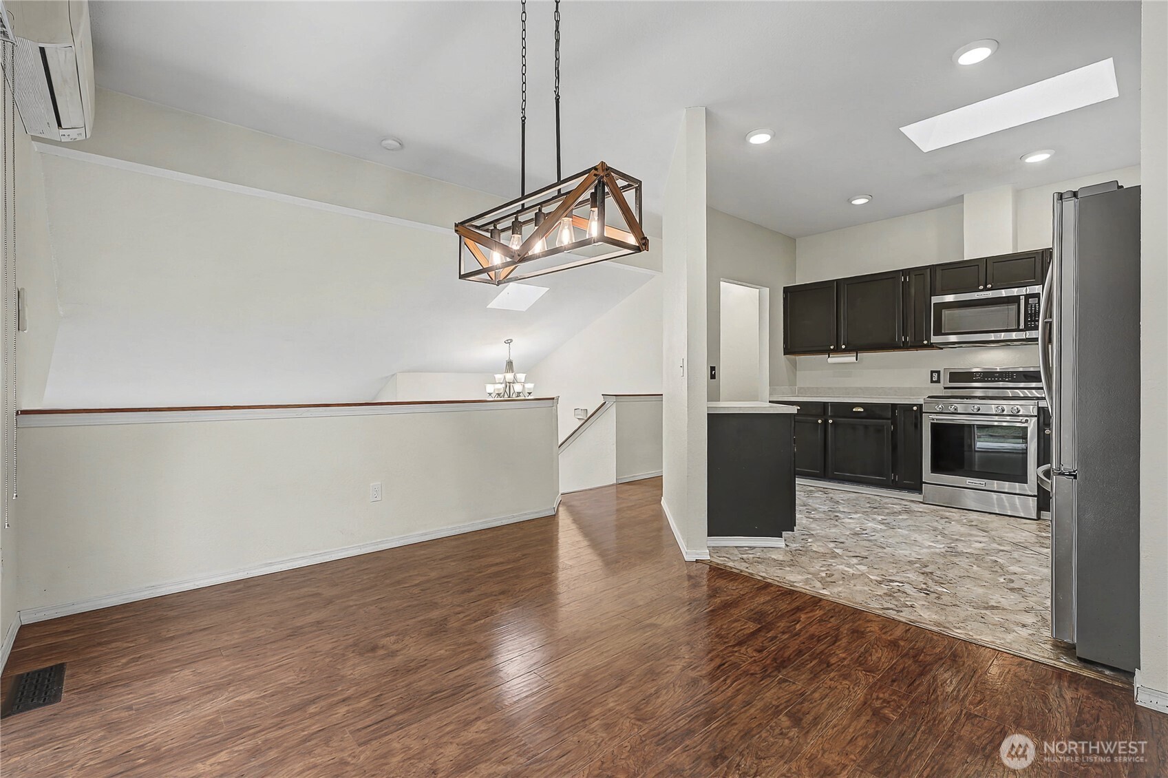 7239 Long Lake Road Southeast Port Orchard, WA 98367 - Photo 6 of 22 a kitchen with stainless steel appliances granite countertop a refrigerator a stove top oven a sink and dishwasher