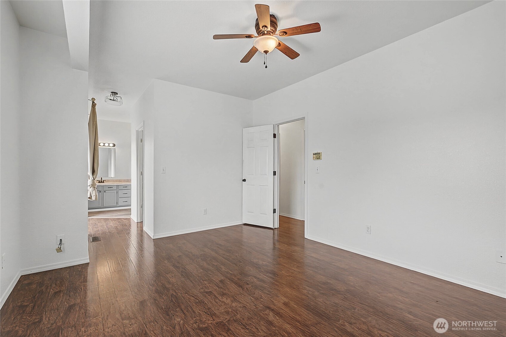 7239 Long Lake Road Southeast Port Orchard, WA 98367 - Photo 9 of 22 a view of empty room with wooden floor