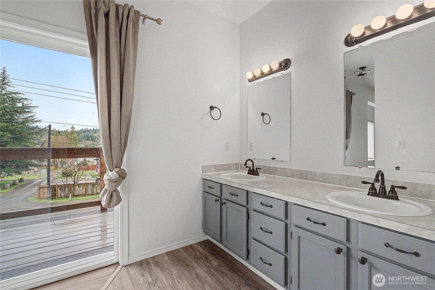 7239 Long Lake Road Southeast Port Orchard, WA 98367 - Photo 10 of 22 a bathroom with a double vanity sink and a mirror
