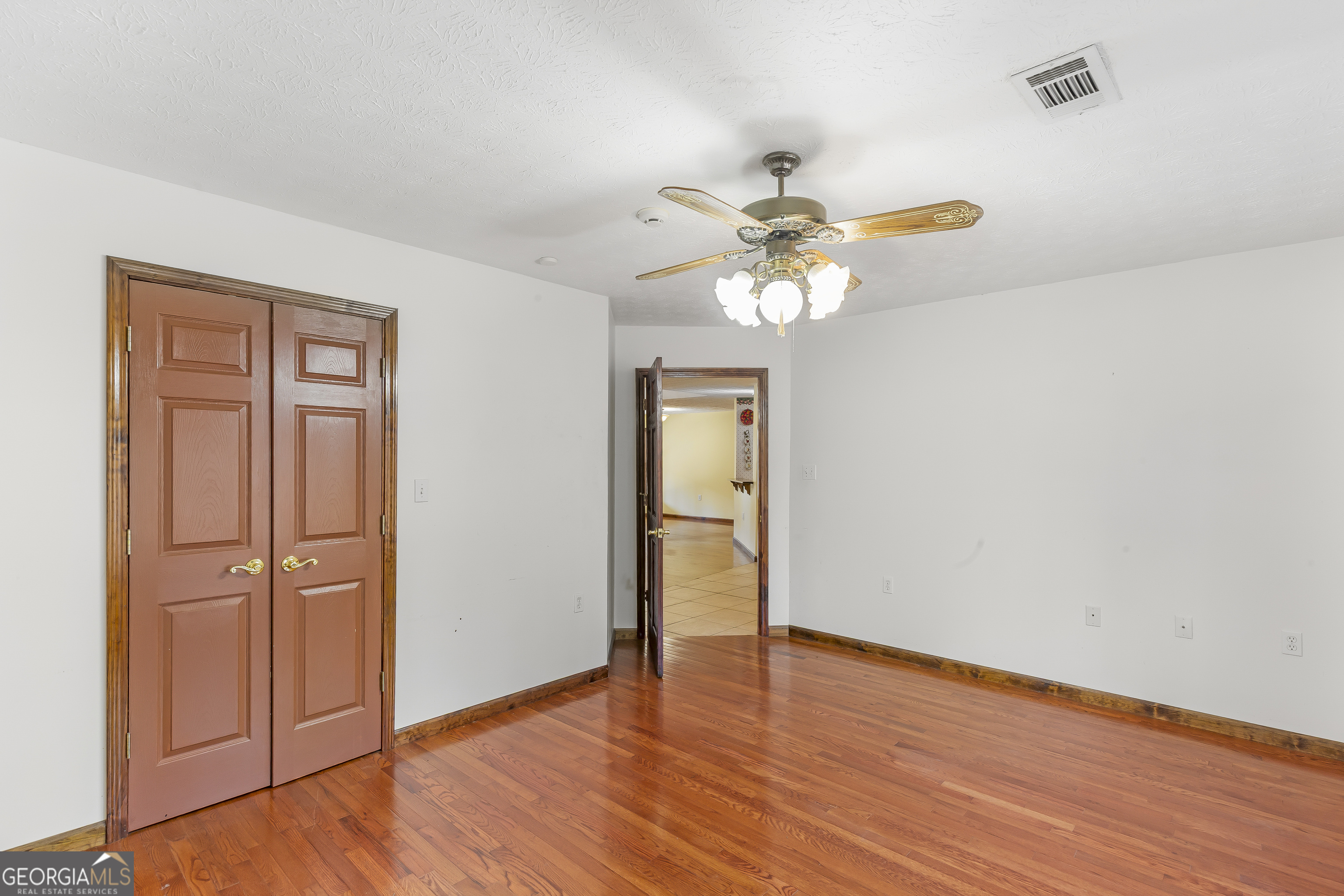 269 High Point Road Buchanan, GA 30113 - Photo 15 of 41 a view of an empty room with wooden floor