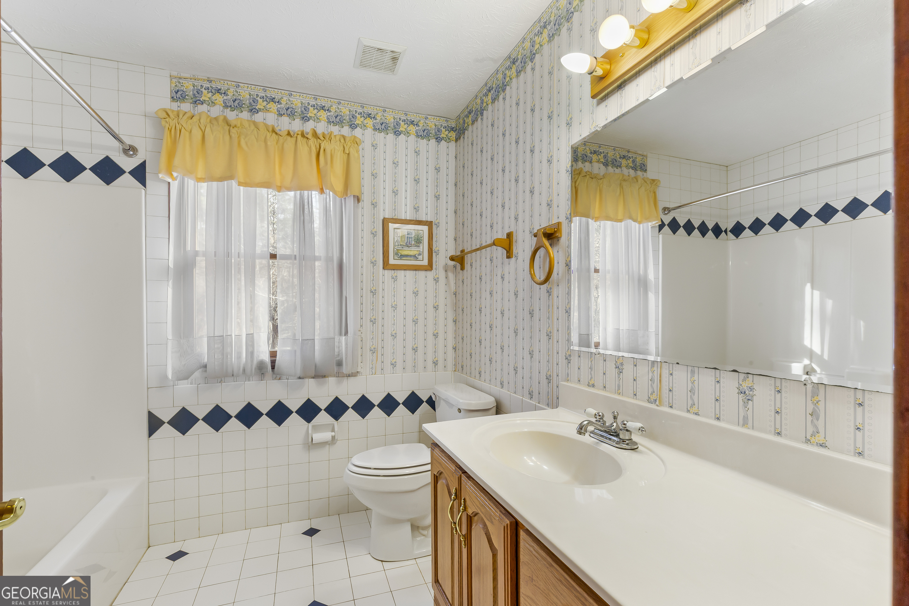 269 High Point Road Buchanan, GA 30113 - Photo 33 of 41 a bathroom with a sink and a mirror