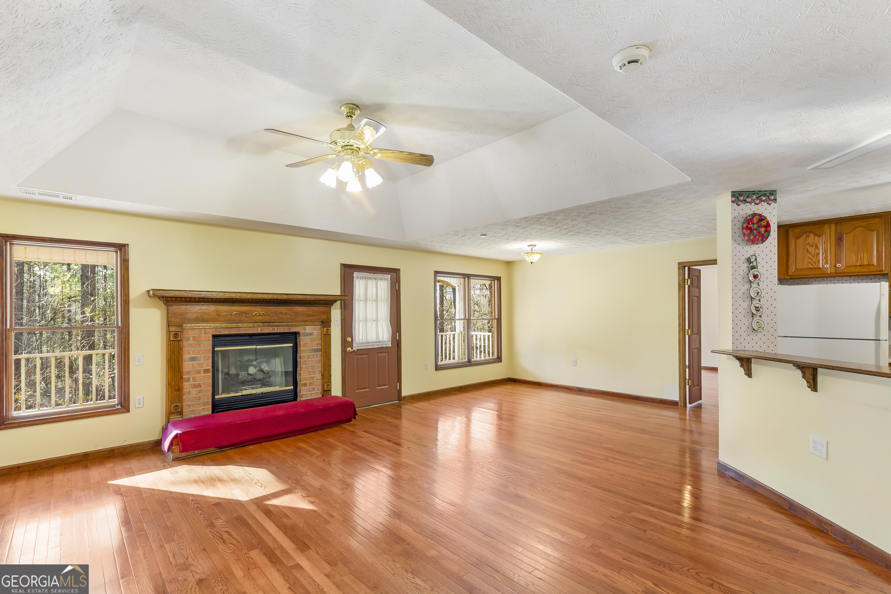 269 High Point Road Buchanan, GA 30113 - Photo 5 of 41 a living room with fireplace furniture and a fireplace
