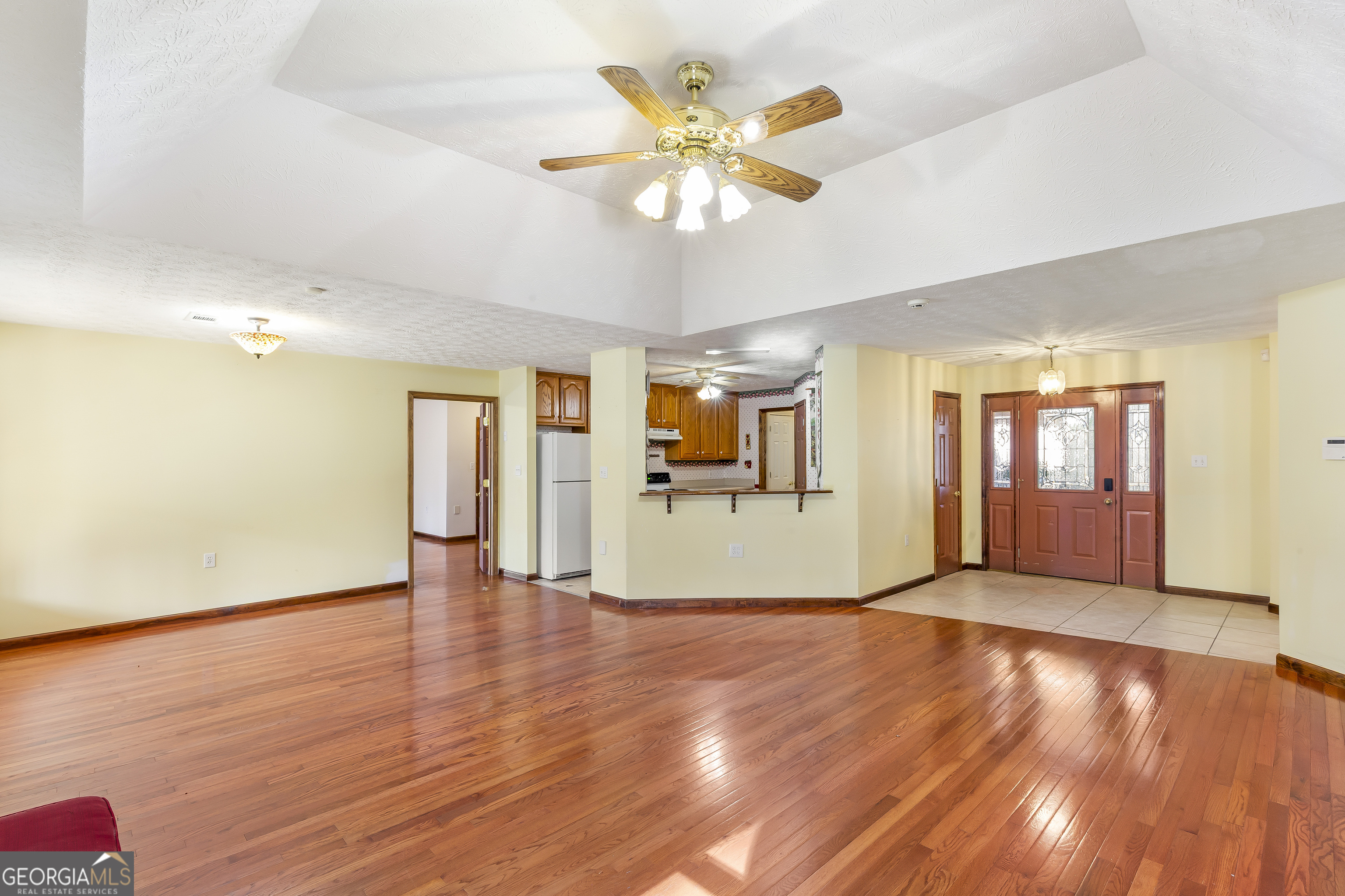 269 High Point Road Buchanan, GA 30113 - Photo 6 of 41 a view of an empty room with window and wooden floor