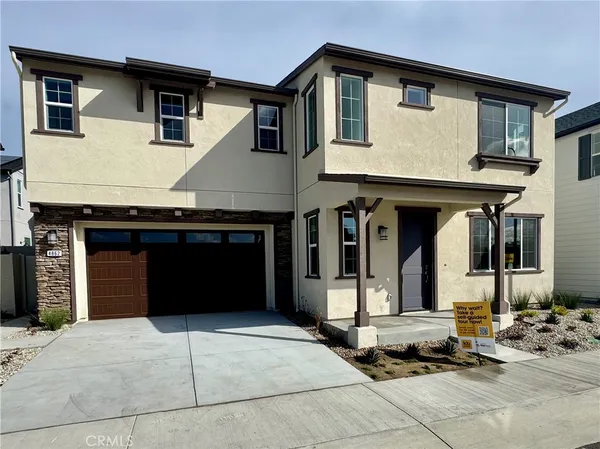 a front view of a house with parking