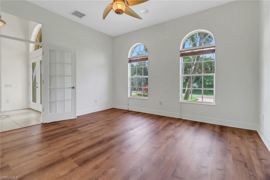 15480 River By Road Fort Myers, FL 33908 - Photo 20 of 48 Spare room with ceiling fan, plenty of natural light, light hardwood / wood-style flooring, and french doors