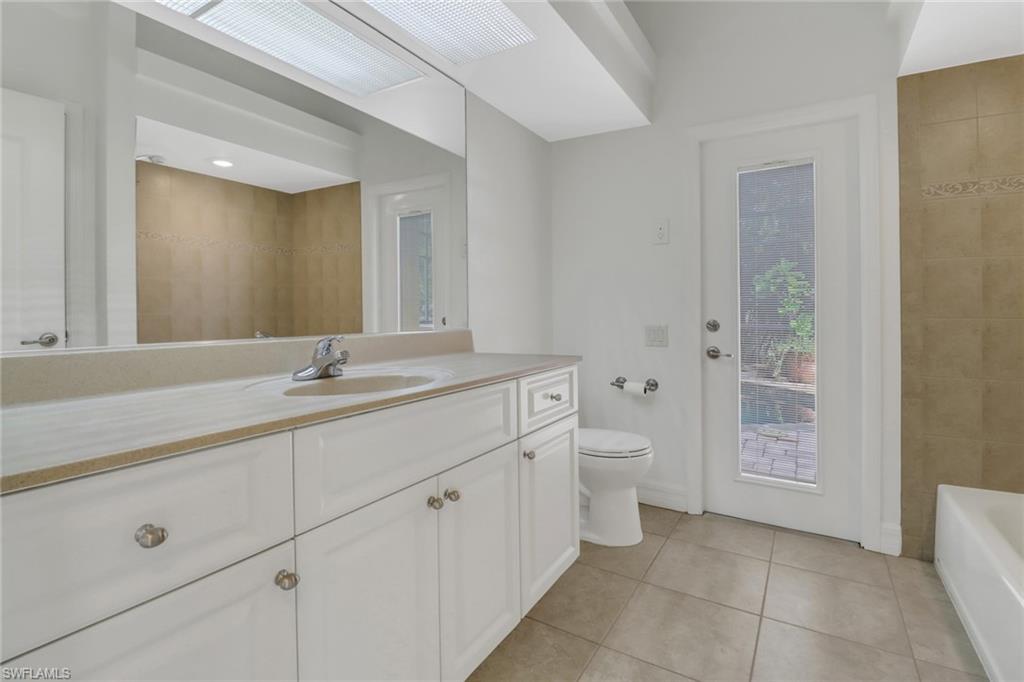 15480 River By Road Fort Myers, FL 33908 - Photo 27 of 48 Bathroom featuring tile patterned floors, toilet, and vanity