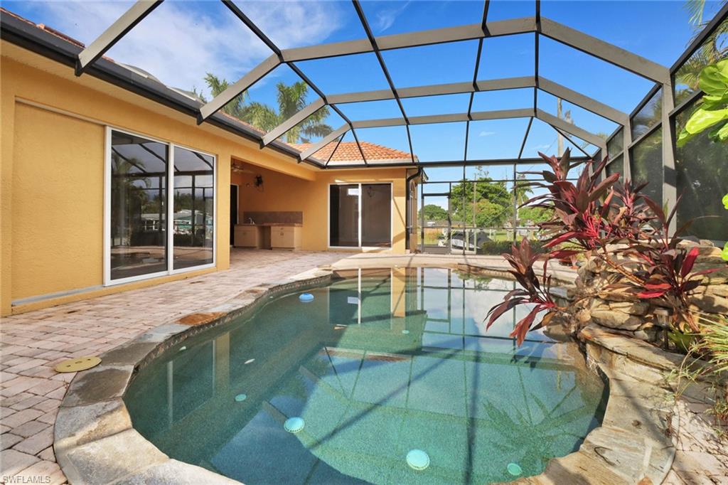 15480 River By Road Fort Myers, FL 33908 - Photo 35 of 48 View of pool with glass enclosure and a patio