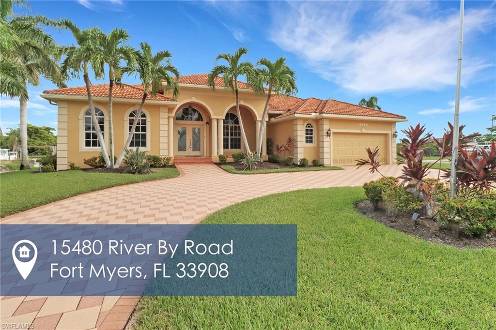 15480 River By Road Fort Myers, FL 33908 - Photo 48 of 48 Modern home with a garage and a front lawn