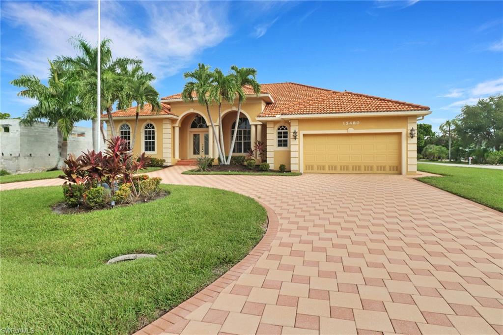 15480 River By Road Fort Myers, FL 33908 - Photo 6 of 48 Mediterranean / spanish-style house with a front lawn and a garage