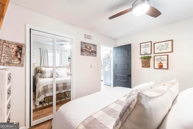 a living room with furniture and floor to ceiling windows