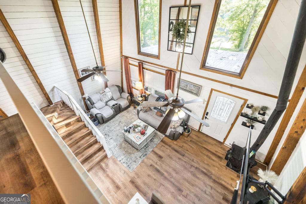 872 Henderson Road Dublin, GA 31021 - Photo 12 of 41 a living room with furniture and floor to ceiling windows