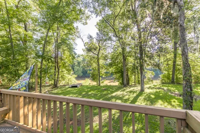 a view of a big yard with table and chairs