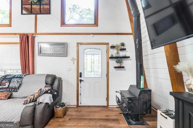 a living room with furniture and a dining table