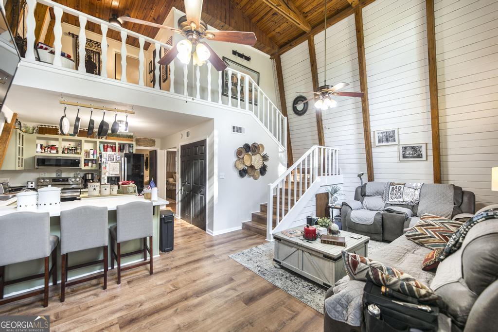 872 Henderson Road Dublin, GA 31021 - Photo 33 of 41 a living room with furniture and a dining table