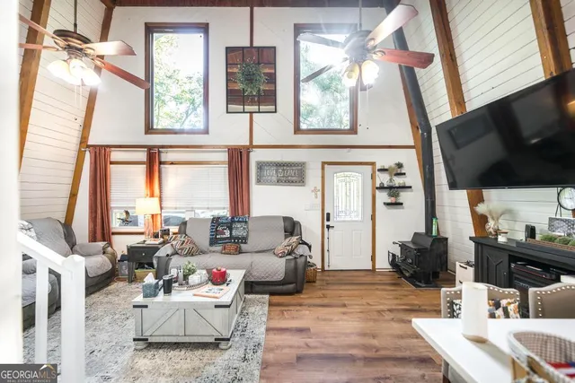 a living room with furniture and a flat screen tv
