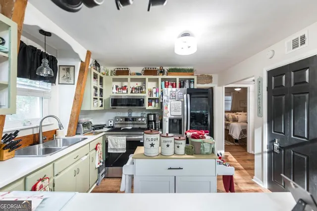 a kitchen with sink and window