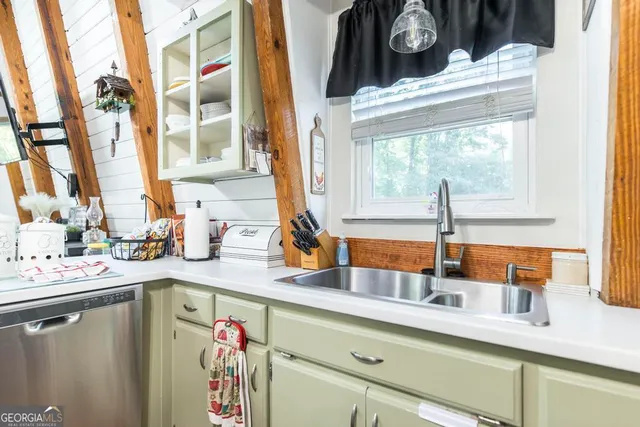 a kitchen with stainless steel appliances granite countertop a stove and a microwave
