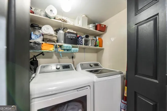 a view of a livingroom with furniture and a flat screen tv