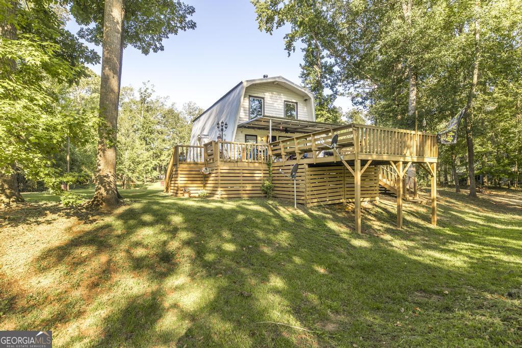 872 Henderson Road Dublin, GA 31021 - Photo 4 of 41 a front view of a house with a big yard