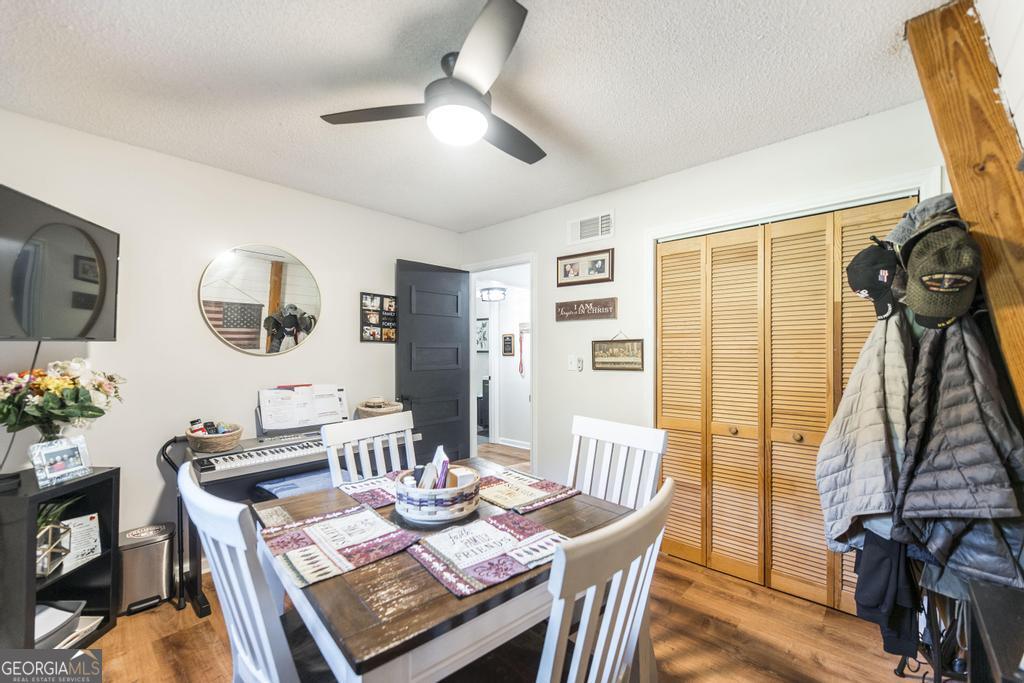 872 Henderson Road Dublin, GA 31021 - Photo 8 of 41 a view of a dining room with furniture window and wooden floor