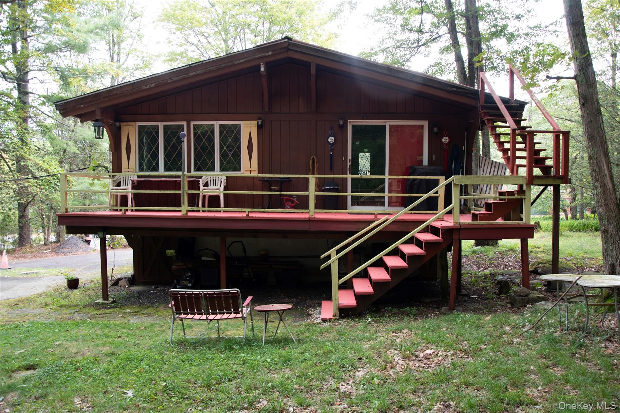 177 Davos Road Woodridge, NY 12789 - Photo 4 of 11 a view of a house with a yard chairs and iron fence