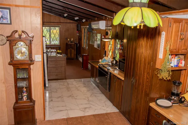 a view of a entryway door with furniture and livingroom view